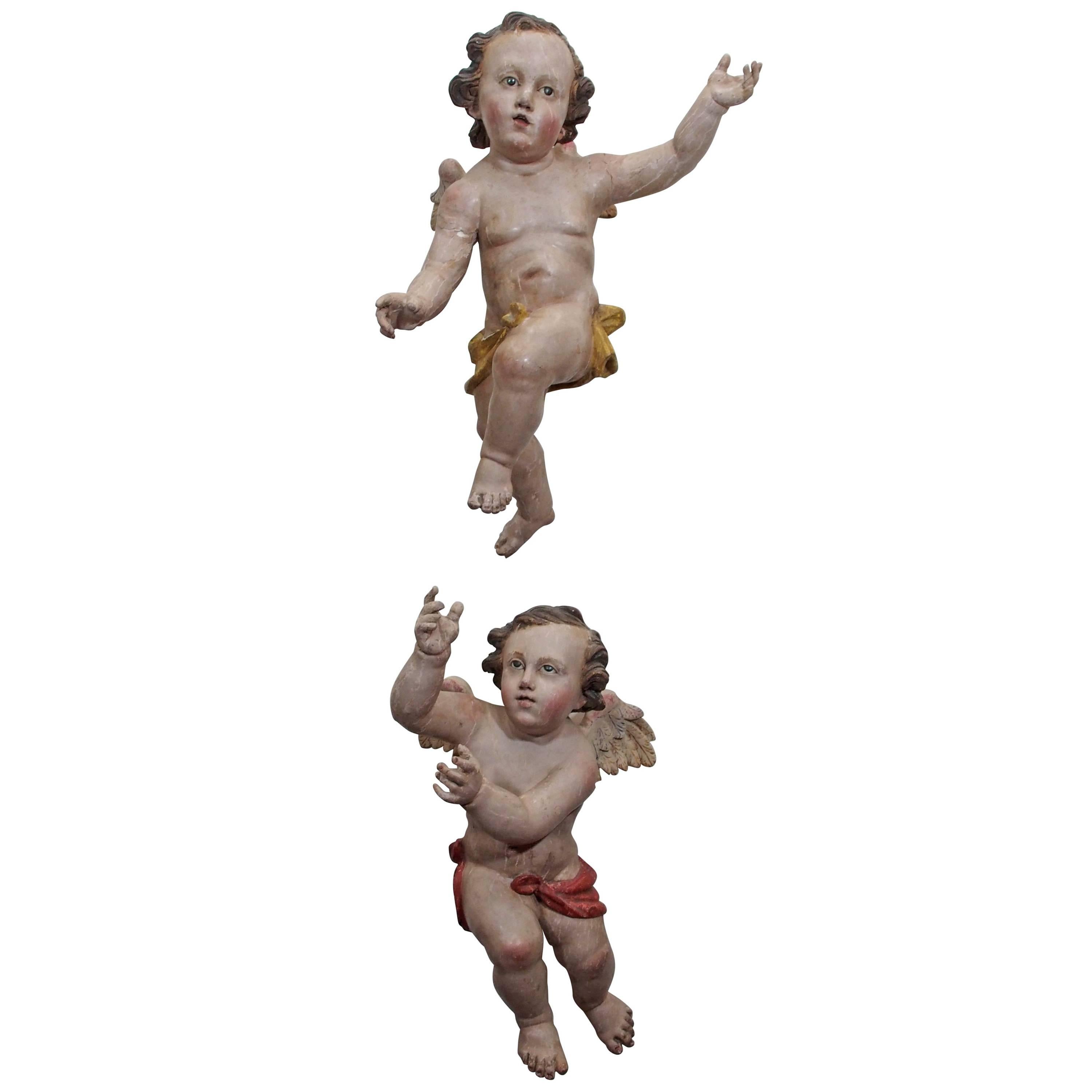 Pair of Painted Carved Wood Putti with Glass Eyes
