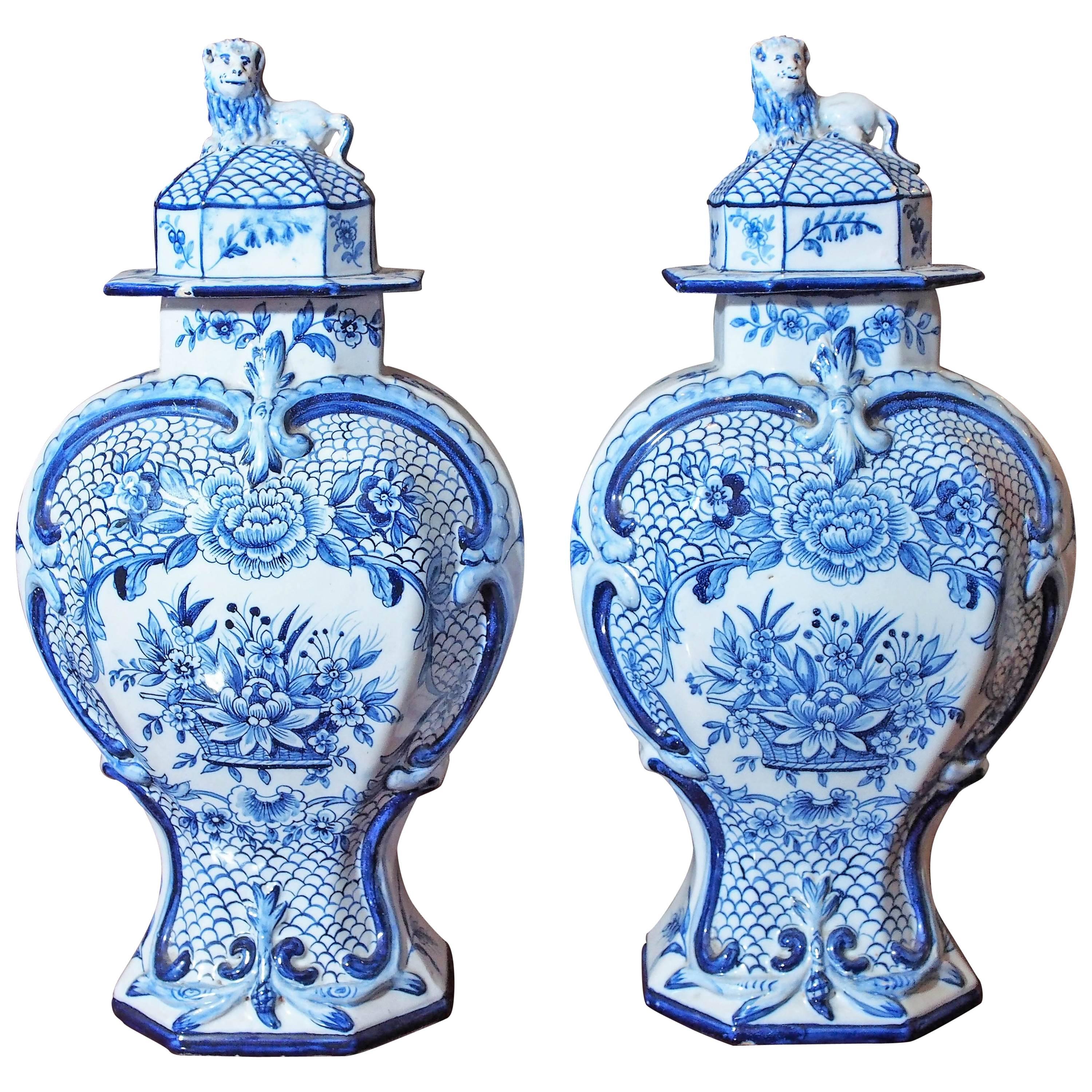 Pair of Delft Garniture Vases with Lion Finials