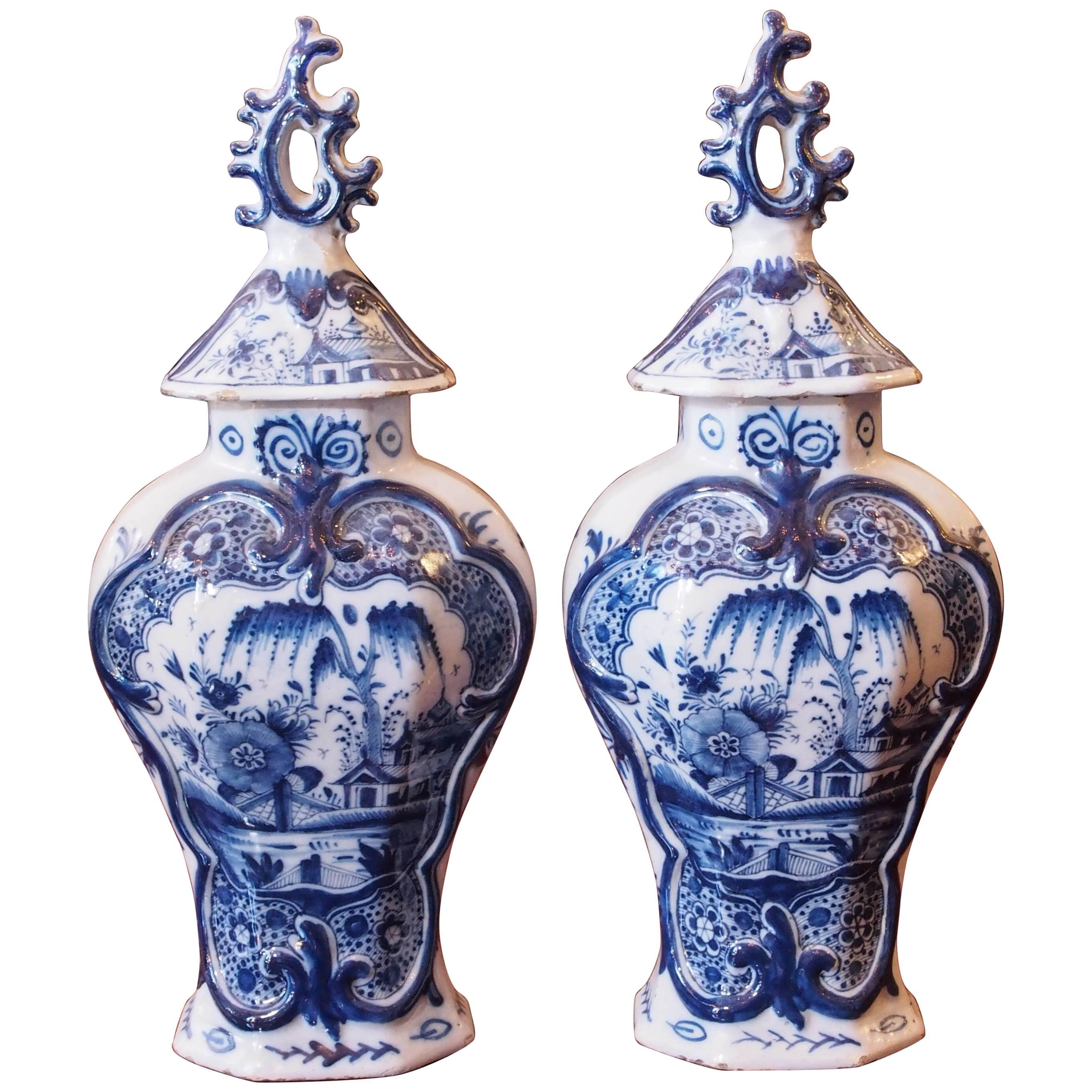 Pair of Delft Blue and White Lidded Garniture Vases