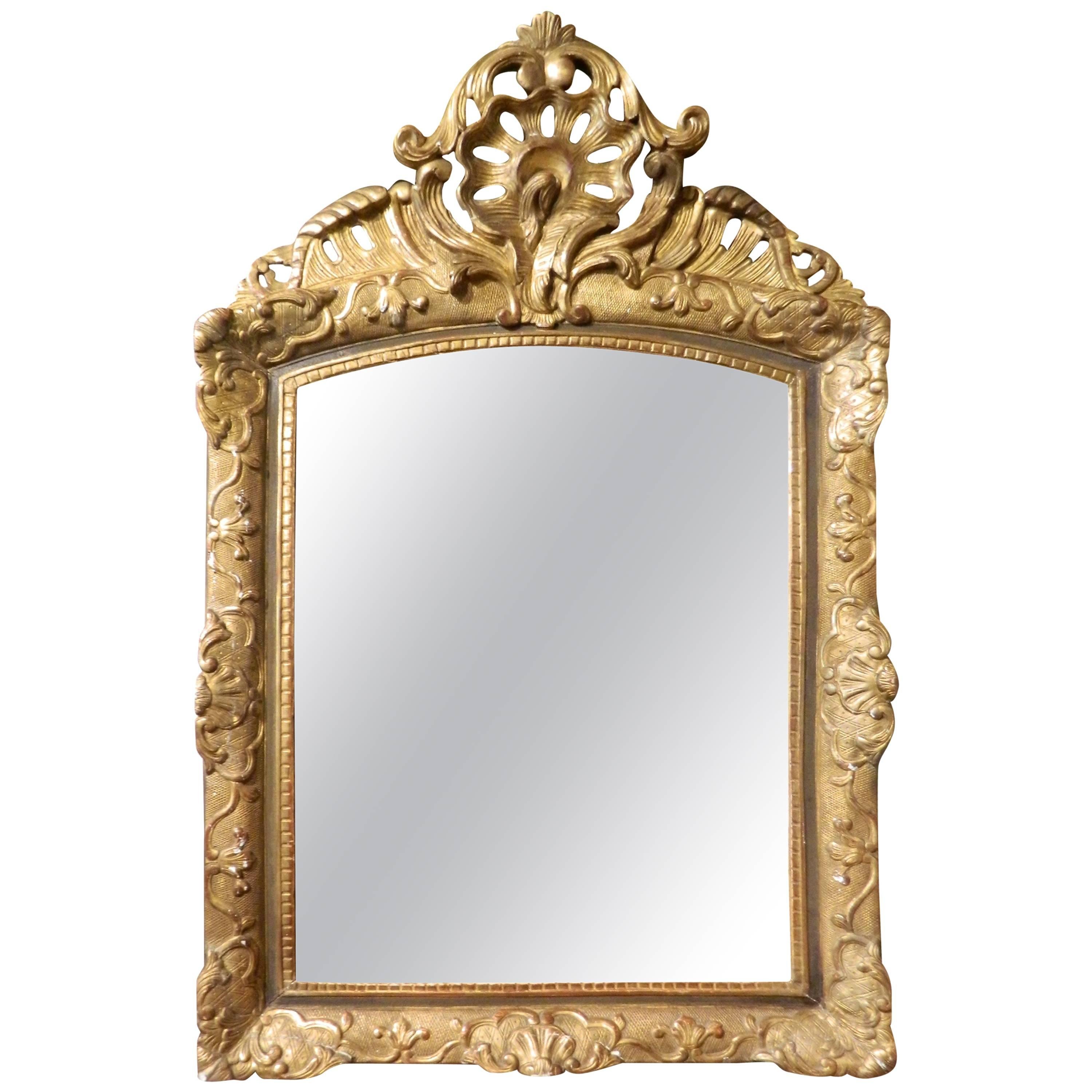 Italian Gilt Gesso Mirror Adorned with a Rocaille Crest, 18th Century For Sale