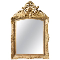 Italian Gilt Gesso Mirror Adorned with a Rocaille Crest, 18th Century