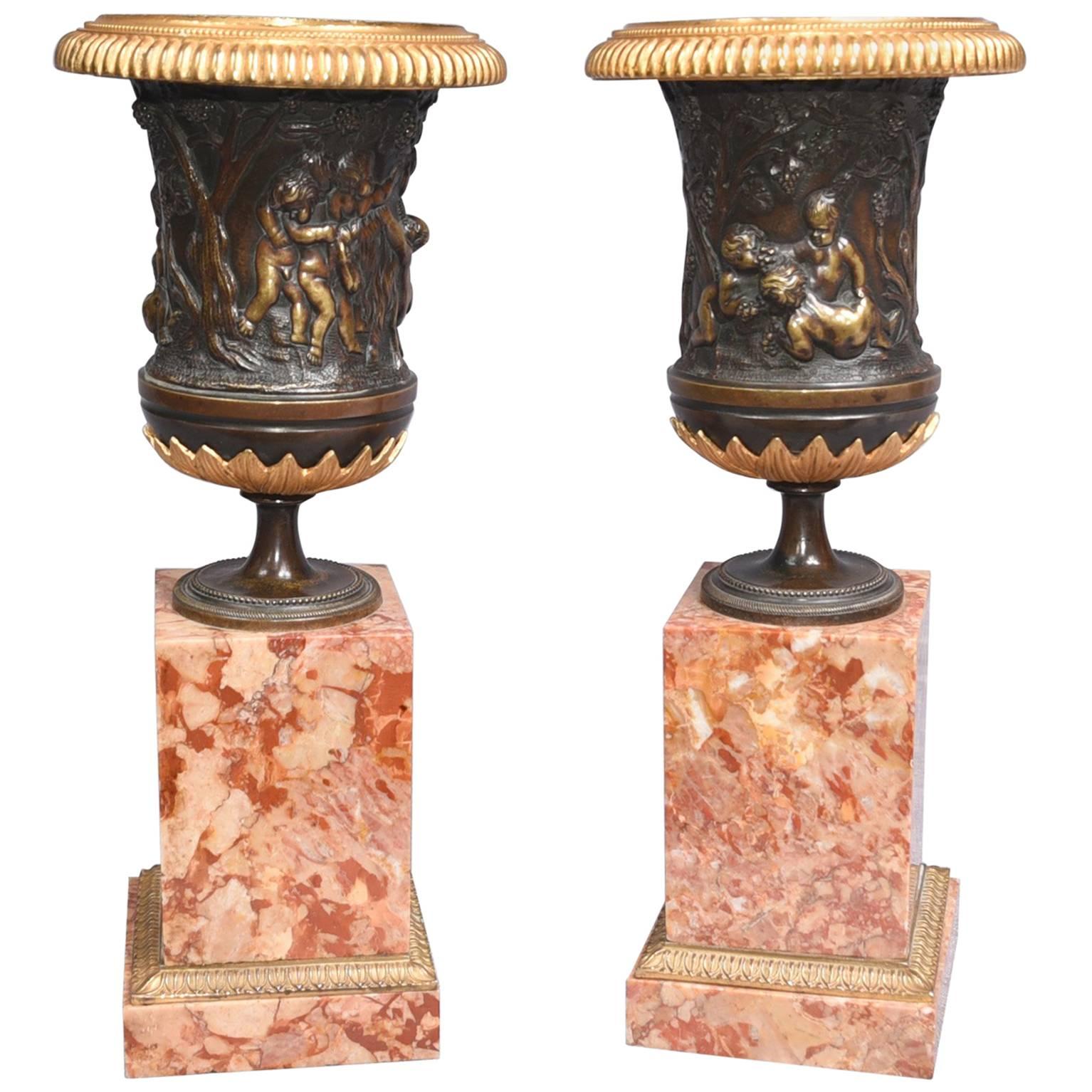 Pair of Italian Grand Tour Bronze Campana Urns on Marble Pedestal Bases, 1900 For Sale