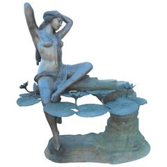 Impressive Bronze Fountain with a Woman on a Ledge with Lily Pads