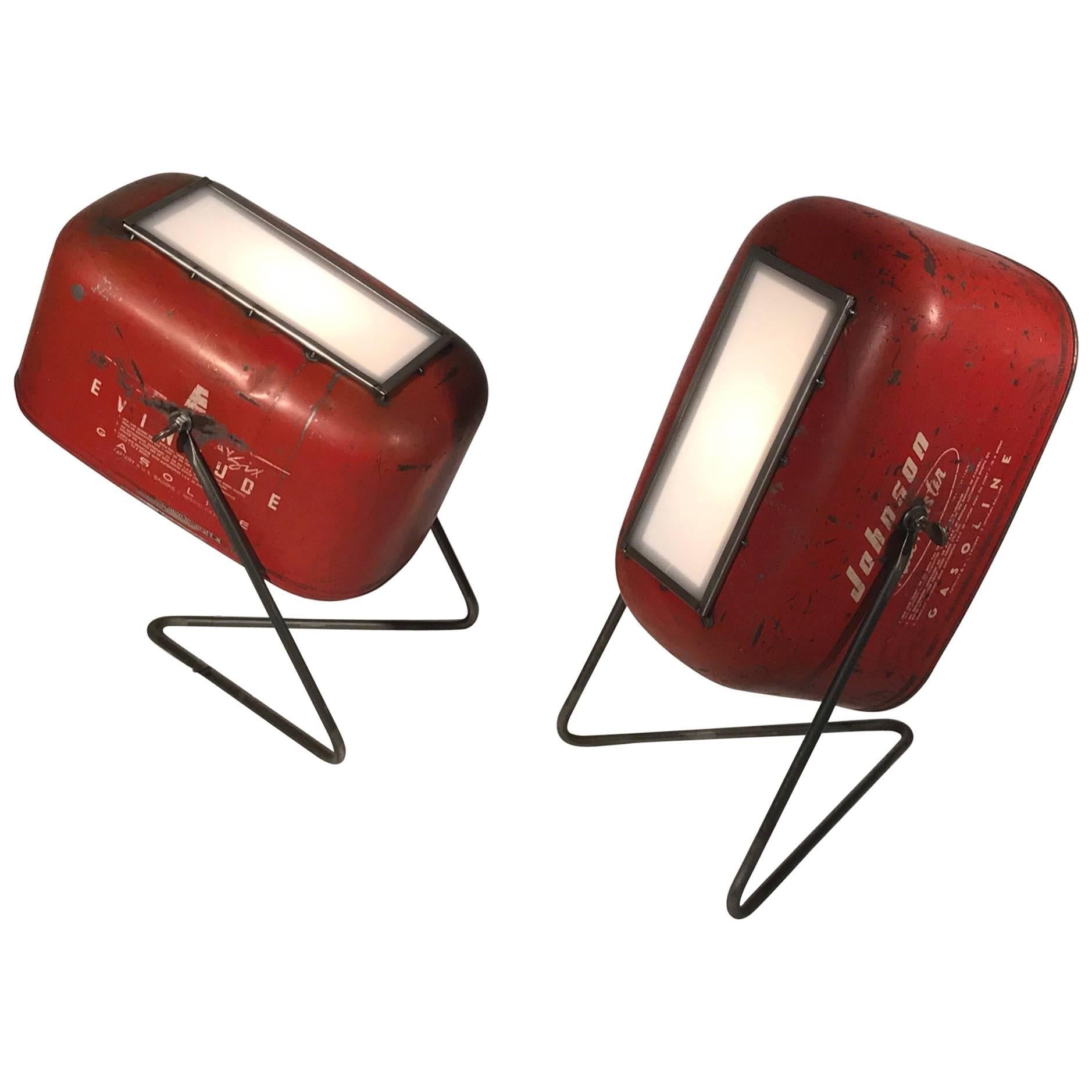 Artisan-created floor lamp spotlights made from early gas cans. The lamps are indoor-only. Each has a turn-switch on the back, and the front panels slide up to change out bulbs. Cords are approximate 7” long. The gas smell has been eradicated, and
