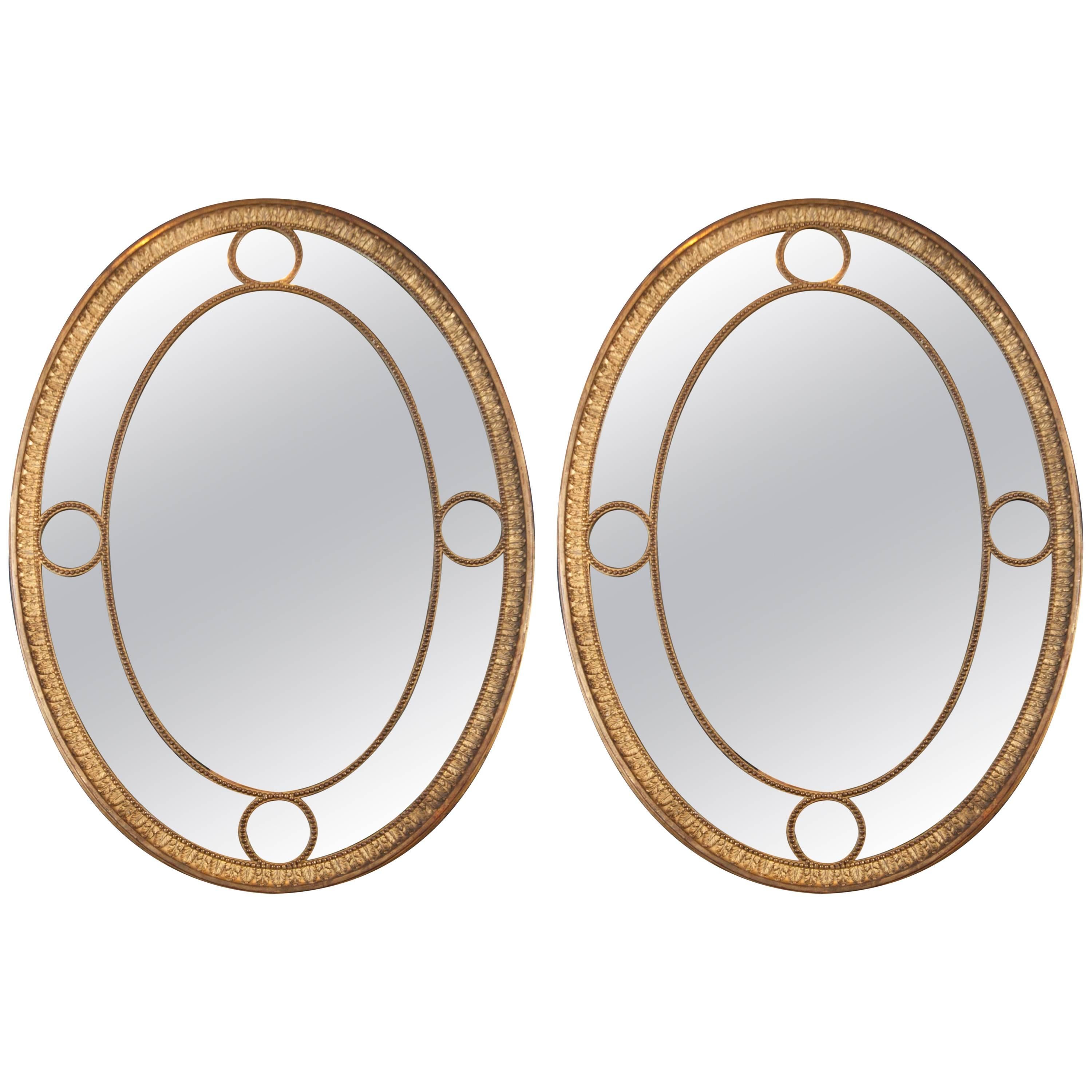 Pair of English Oval Giltwood Mirrors