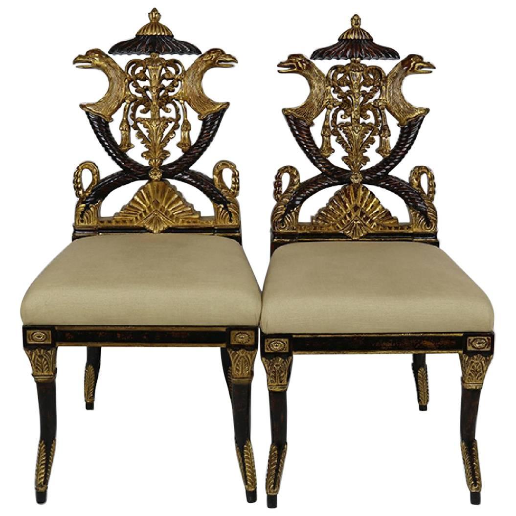 Pair of Carved French Empire Style Decorative Chairs of Ebonized and Giltwood For Sale