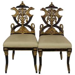 Pair of Carved French Empire Style Decorative Chairs of Ebonized and Giltwood