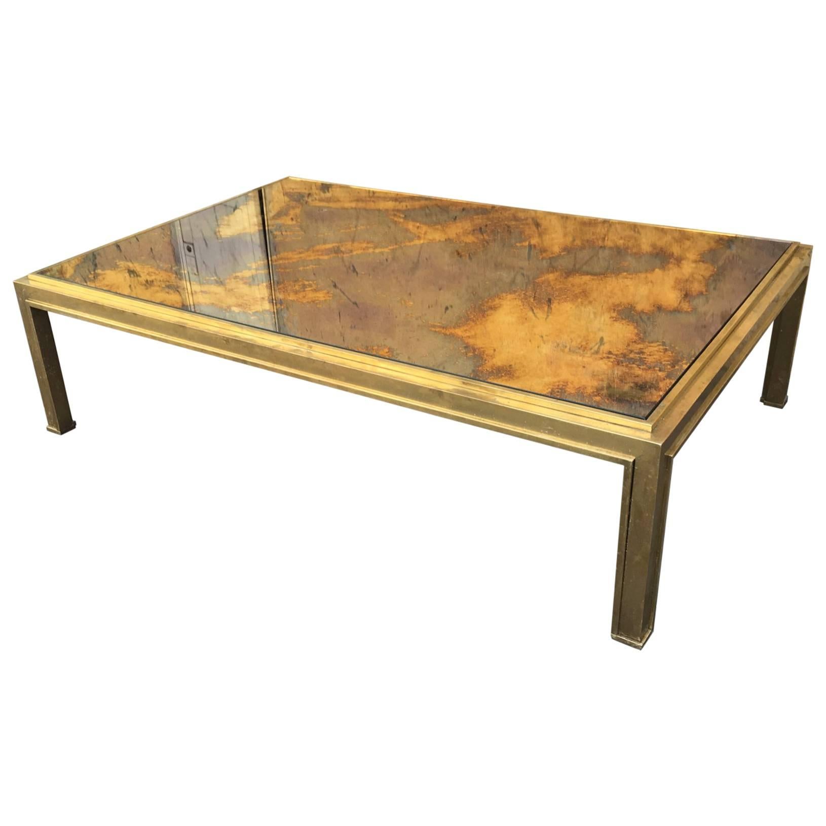 Jacques Adnet Sturdy Gold Bronze Big Coffee Table with a Gold Leaf Mirrored Top For Sale