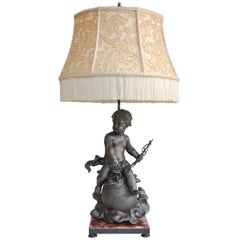 Lead Cherub Figure Wired as a Lamp on a Marble Base