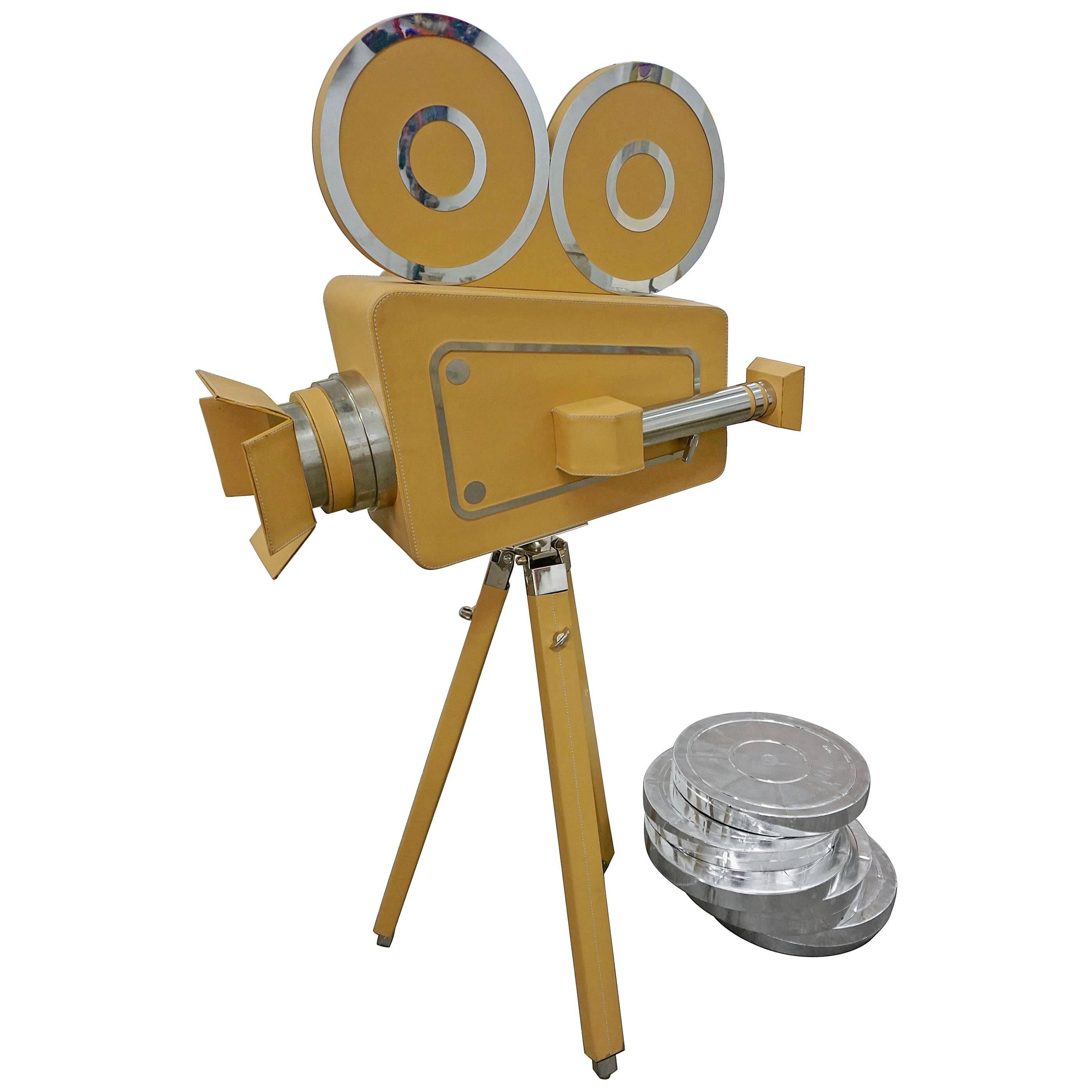 Leatherbound Movie Camera and Film Cans For Sale