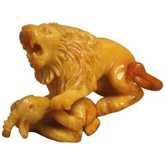 A Two-Piece 20th century Baltic Amber Animal Sculpture Set
