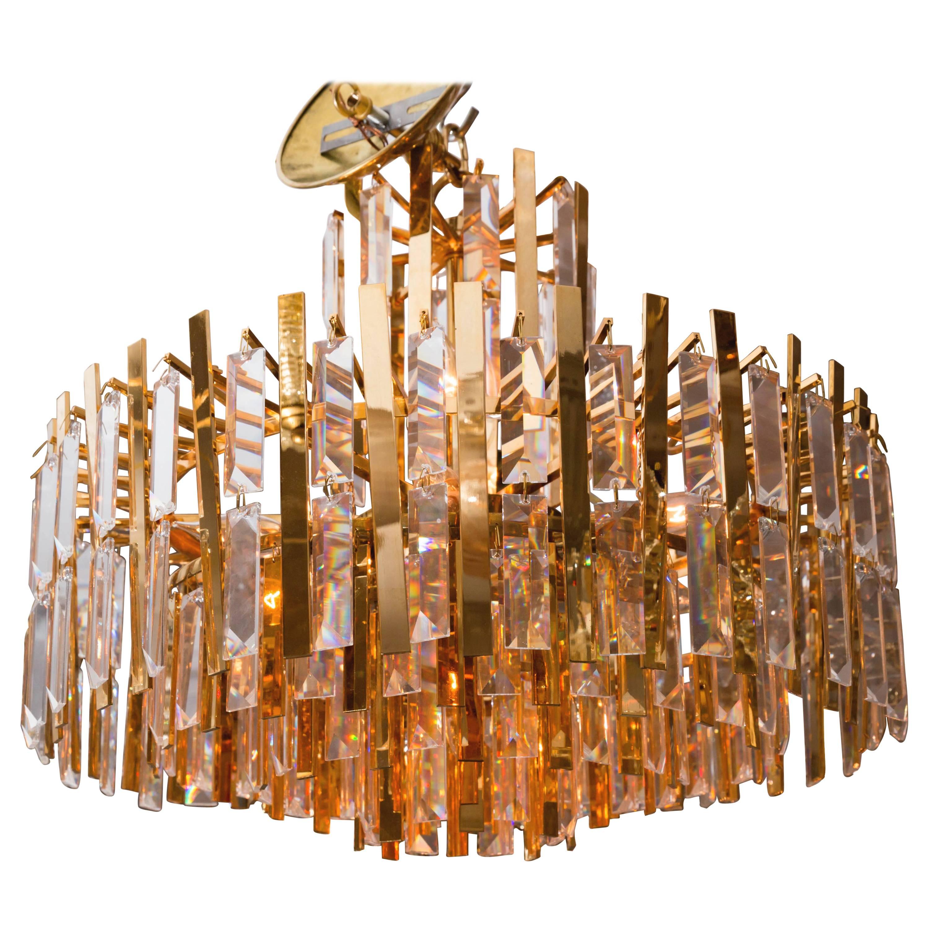 Brass Chandelier Composed of Multiple Suspended Brass Strips and Crystal Prisms For Sale