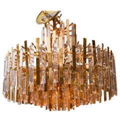 Brass Chandelier Composed of Multiple Suspended Brass Strips and Crystal Prisms