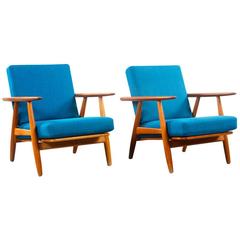 Hans Wegner 1960 famous “Cigar” GE 240 armchairs in Teak and Fabric