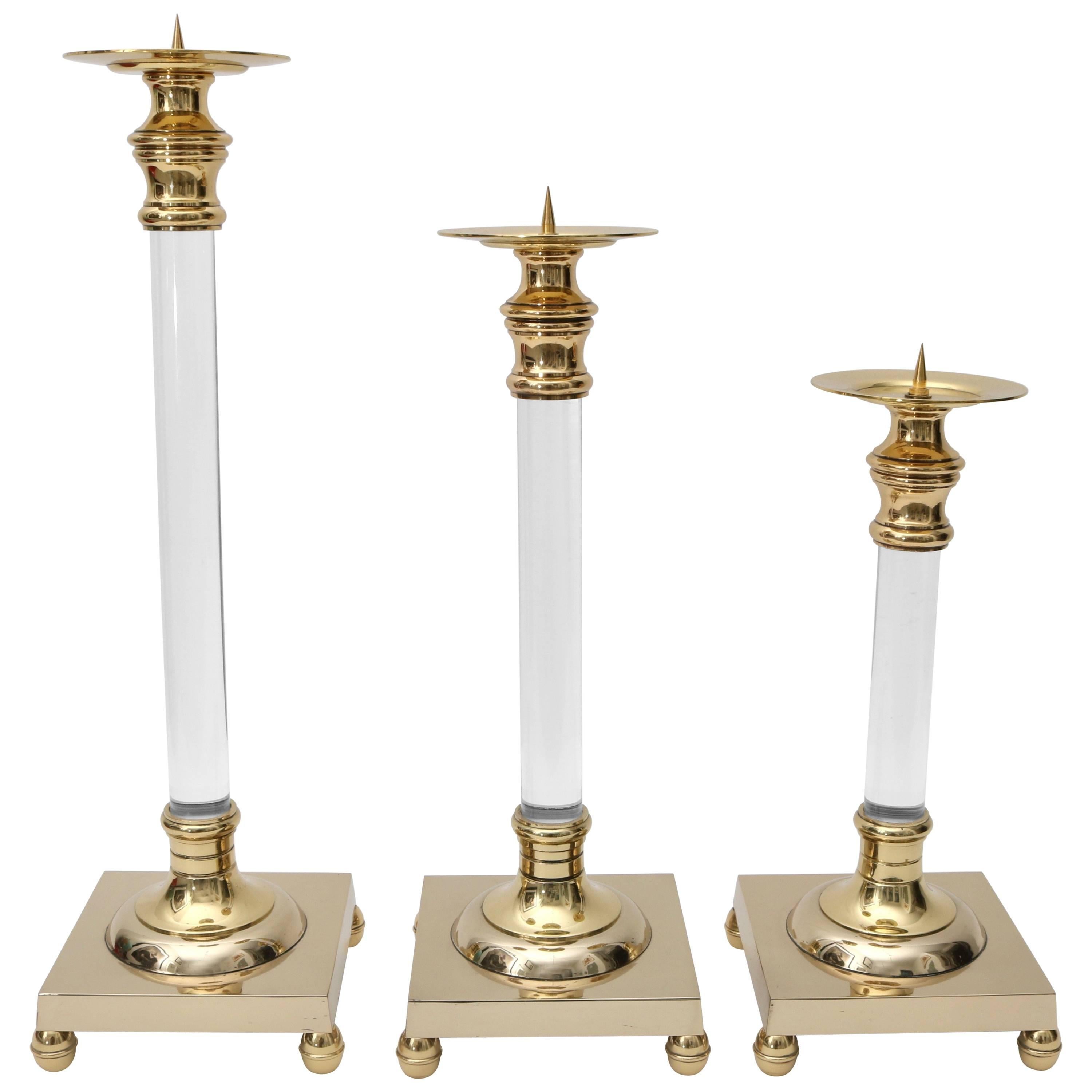 Set of Three Polished Brass and Lucite Candlesticks For Sale
