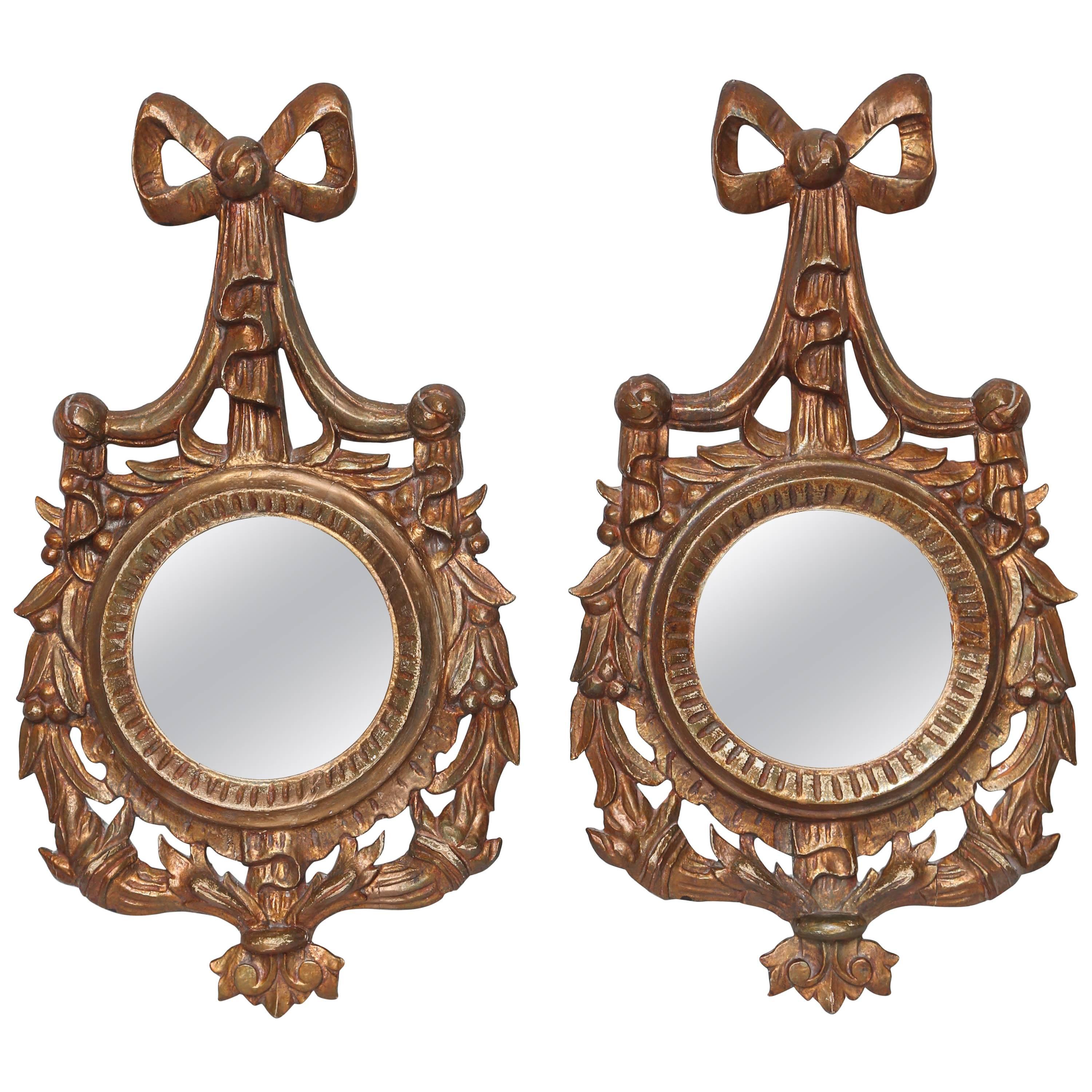 Pair of Carved Wood and Gilded Bow with Swag Mirrors For Sale
