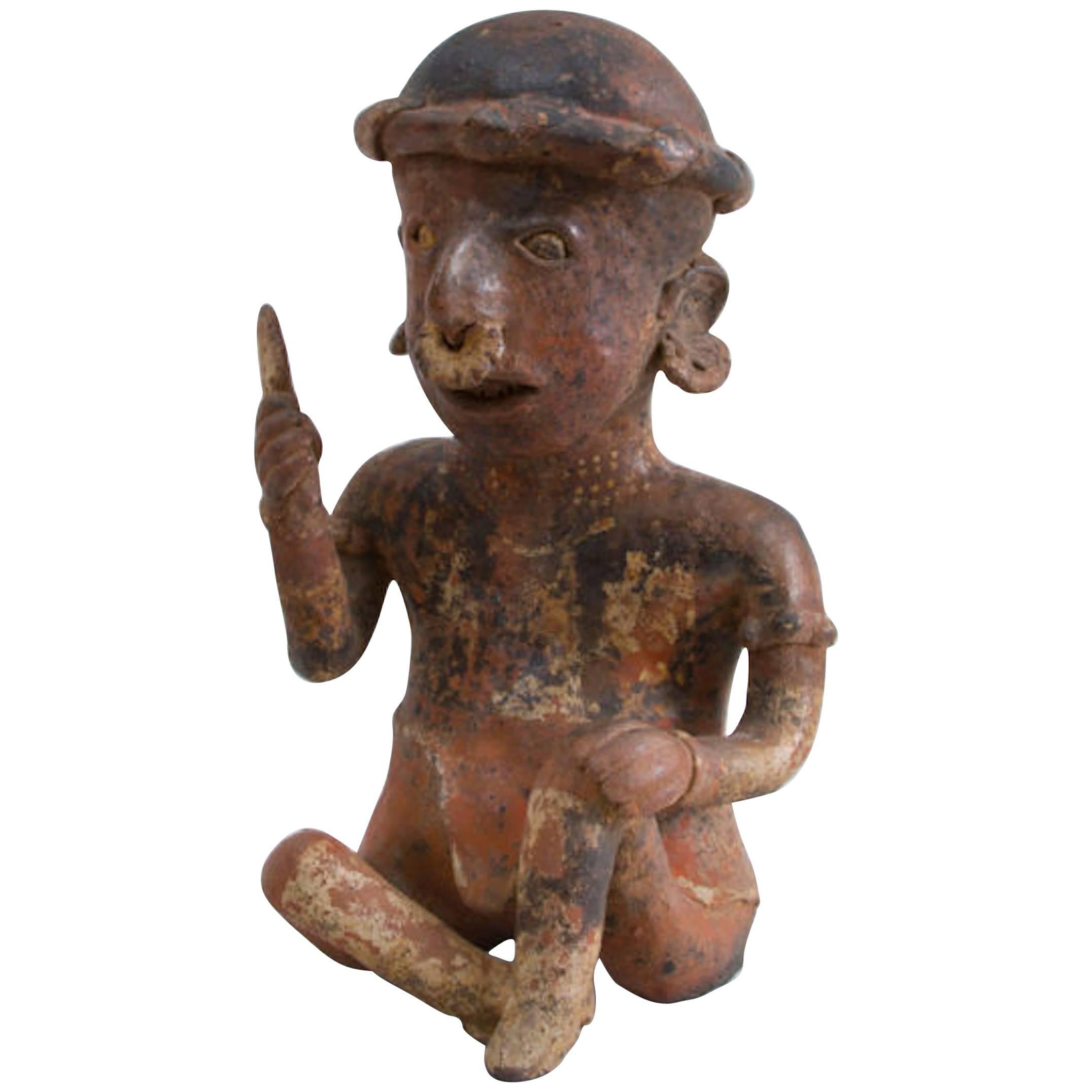 Painted Pottery Figure of a Seated Male