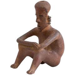 Pre-Columbian Red-Ground Pottery Seated Figure of a Man
