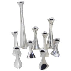 Collection of Nine Richard K. Thomas Nambe Polished Aluminum Candlesticks