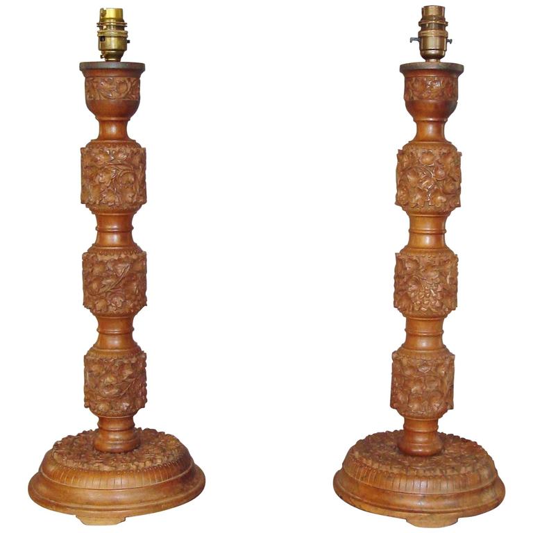Early 20th Century Pair of Indian Carved Walnut Table Lamps For Sale at