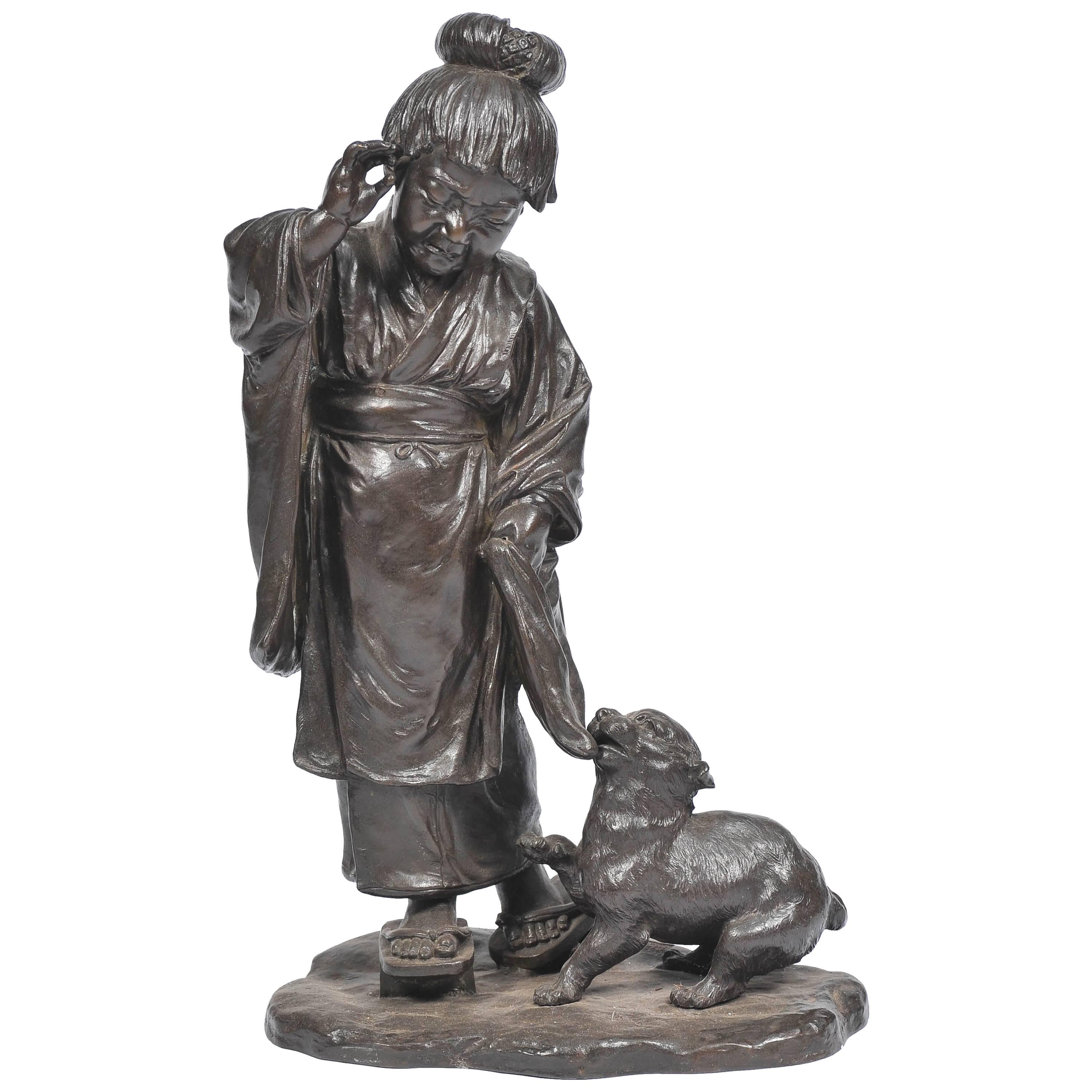 Grand bronze japonais représentant une jeune fille et un chien