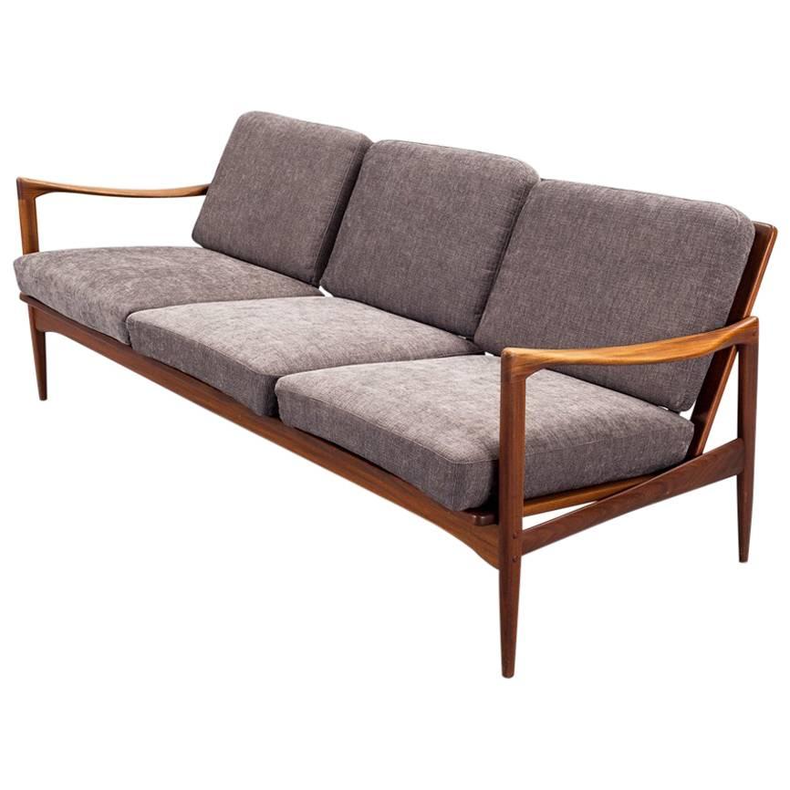  Ib Kofod-Larsen 1960s Kandidaten Sofa in teak and fabric produced by OPE Mobler For Sale