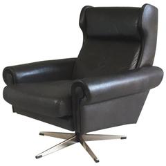 Used 1970s Danish Mid-Century Dark brown Leather Winged Back Swivel Armchair