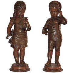 Young Girl and Young Boy a Pair of Patinated Bronze Sculptures by Lecorney