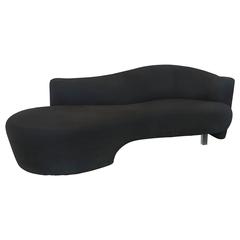 Sensuous Black Serpentine Sofa with Lucite Leg in the Style of Vladimir Kagan