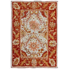 Antique Turkish Oushak with Elegant Motifs in Red, Ivory, Gold and Salmon Pink