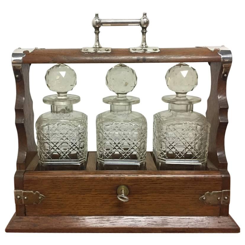 Late Victorian Gothic and Aesthetic Oak Triple Decanter Set