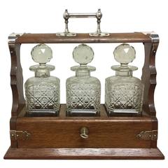 Antique Late Victorian Gothic and Aesthetic Oak Triple Decanter Set