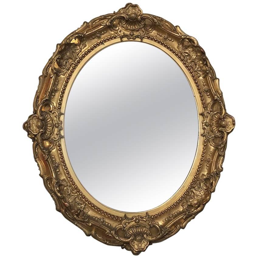 19th Century Gilded Baroque Oval Mirror For Sale at 1stDibs