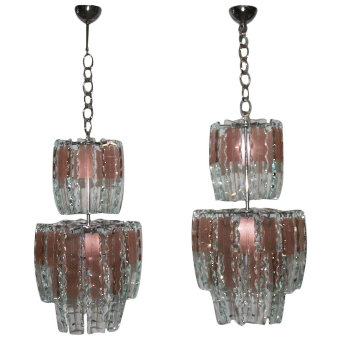 Paire de lustres en verre incurvé des années 1970, cristal, acier, design italien avec inscription