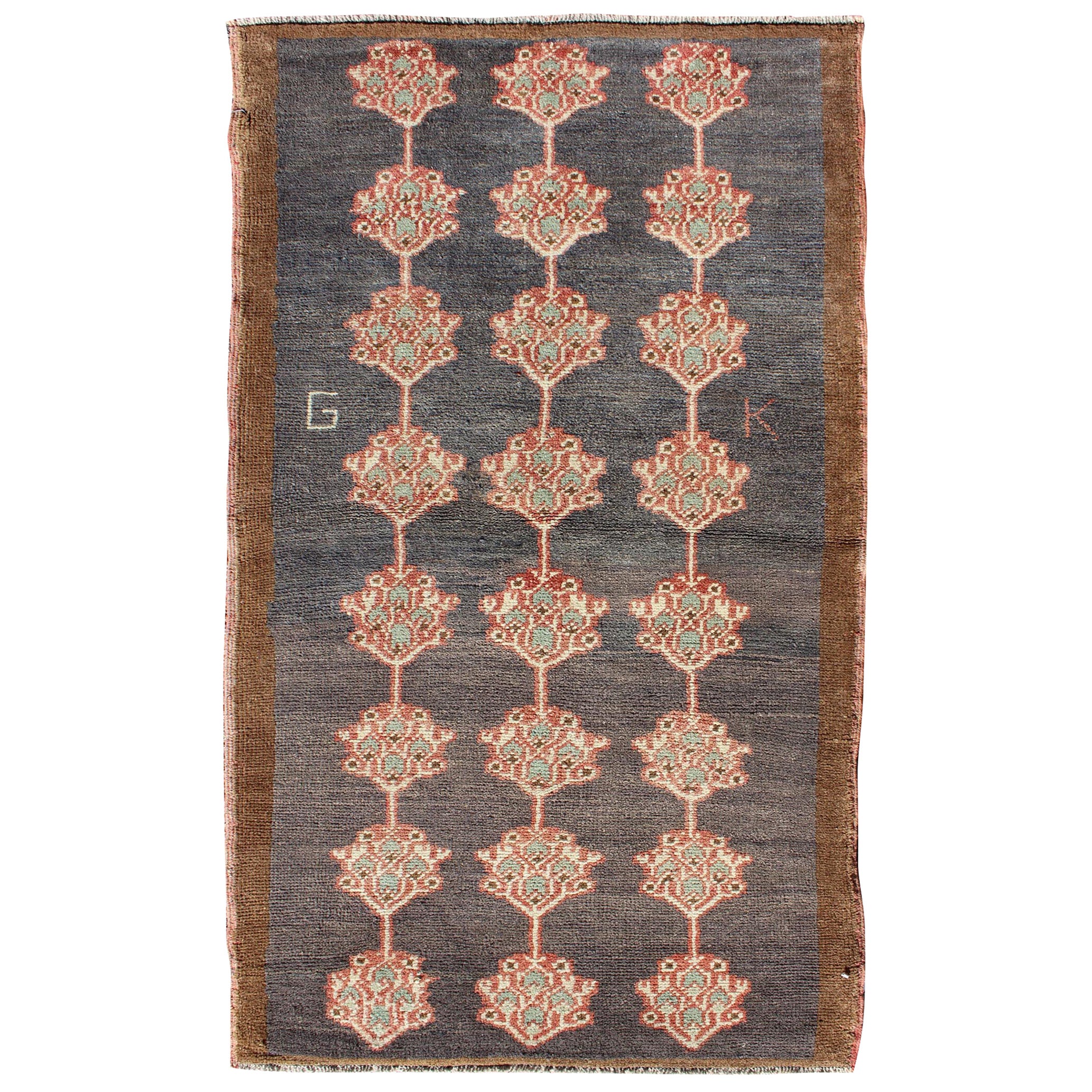 Vintage Turkish Tulu Carpet with Three Rows of Flowers on Gray & Charcoal Field For Sale