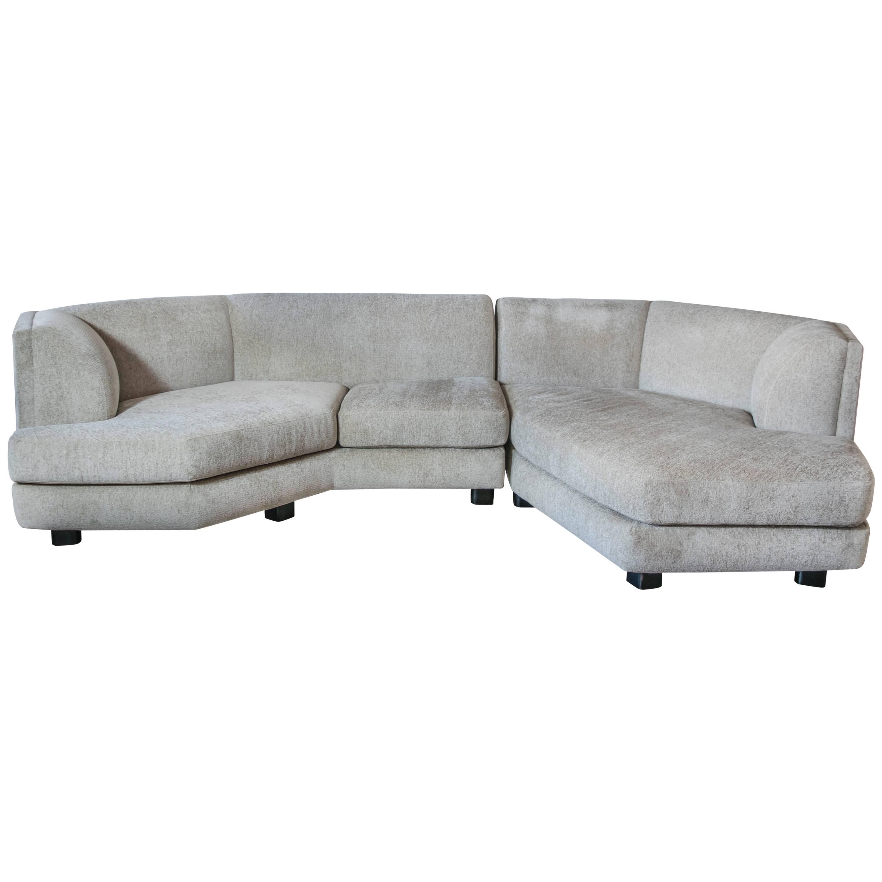This is a gorgeous and what appears to be, custom Milo Baughman for Thayer Coggin (tags attached) two-piece sectional, recently upholstered in a divine oatmeal colored chenille. This couch is extremely stylish and comfortable, perfect for the entire