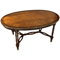 Oval Regency Style Mahogany and Rosewood Cocktail Table