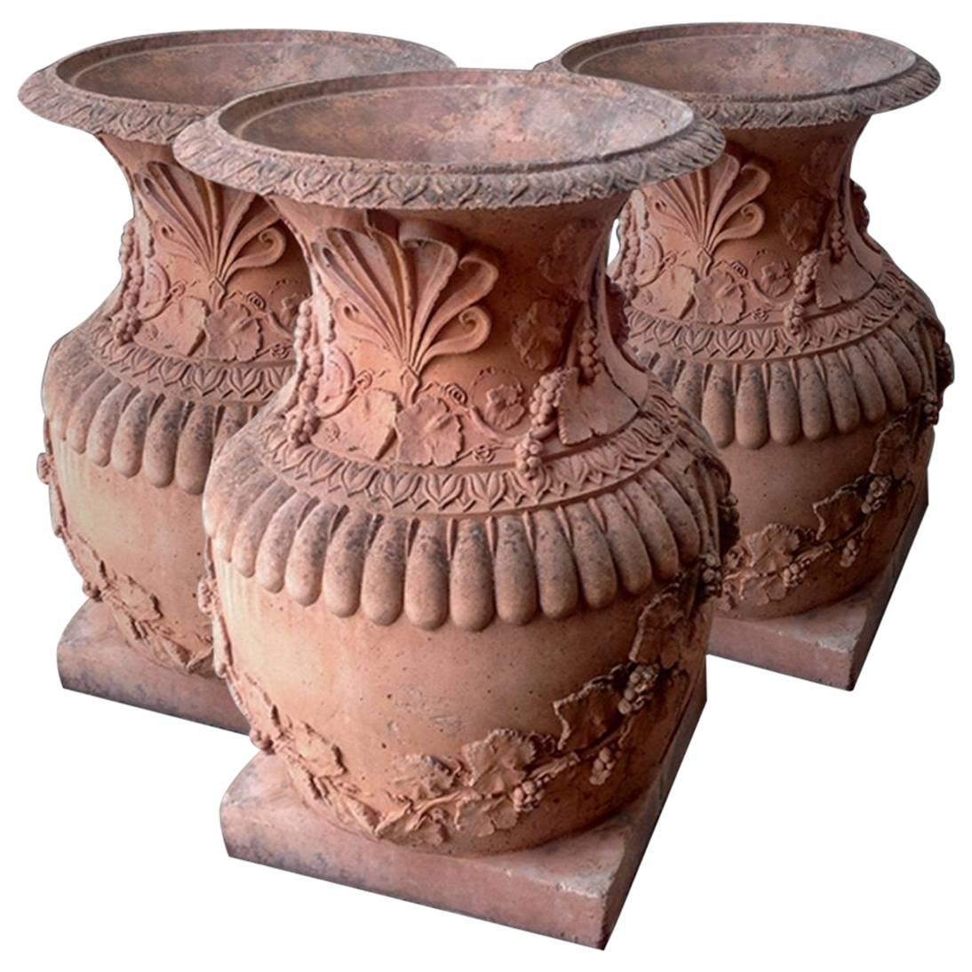 Set of Three Large-Scale Composition Stone Garden Urns For Sale
