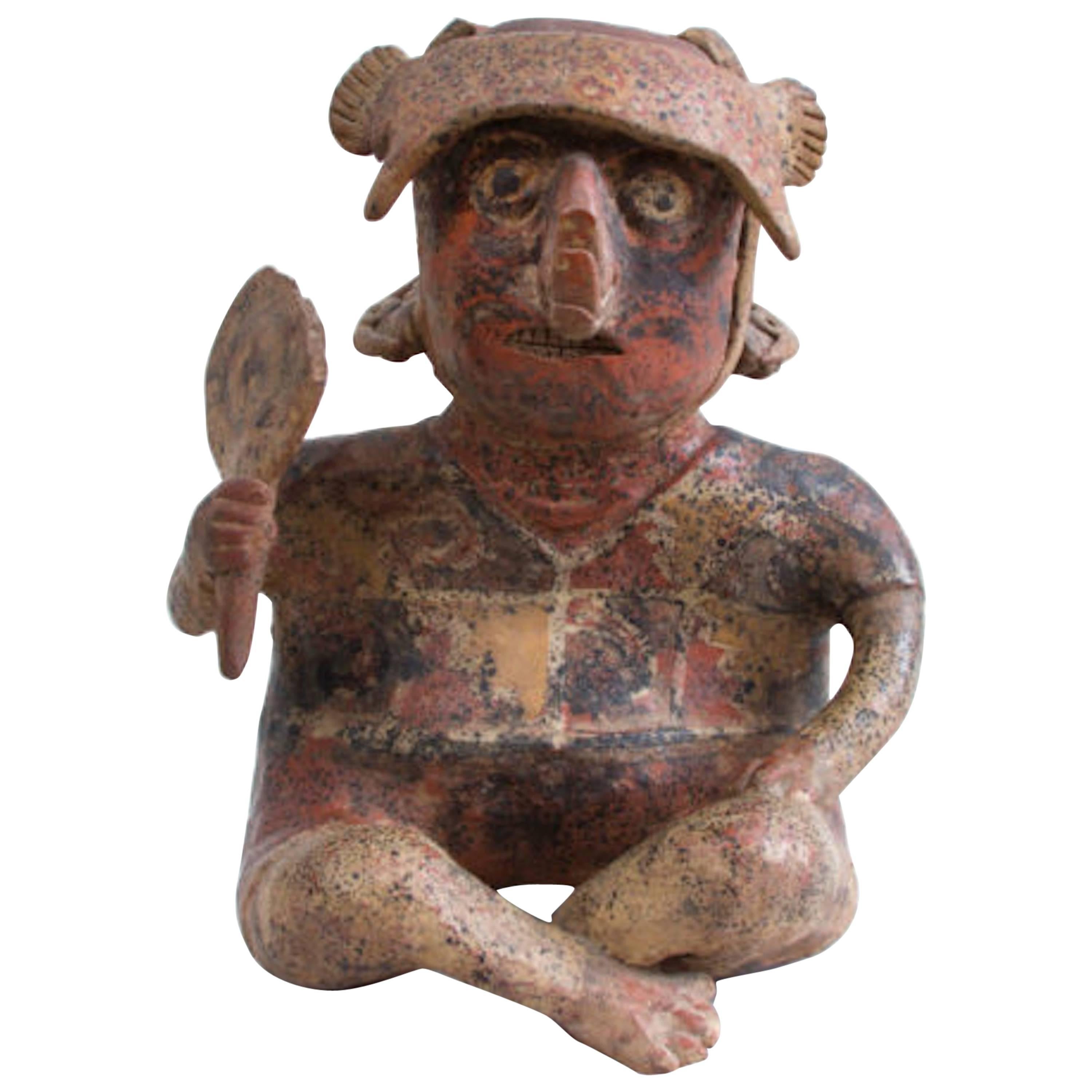 Painted Pottery Figure of a Seated Male