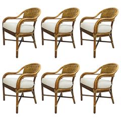 Set of Six Rounded Top Rattan Dining Chairs by McGuire