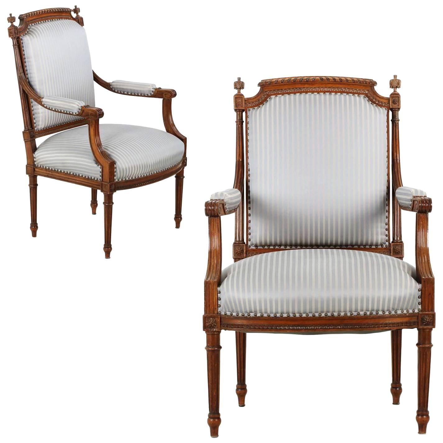 Pair of French Louis XVI Style Carved Walnut Antique Armchairs