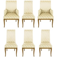 Six Bleached Mahogany and Silk Upholstered Saber Leg Dining Chairs
