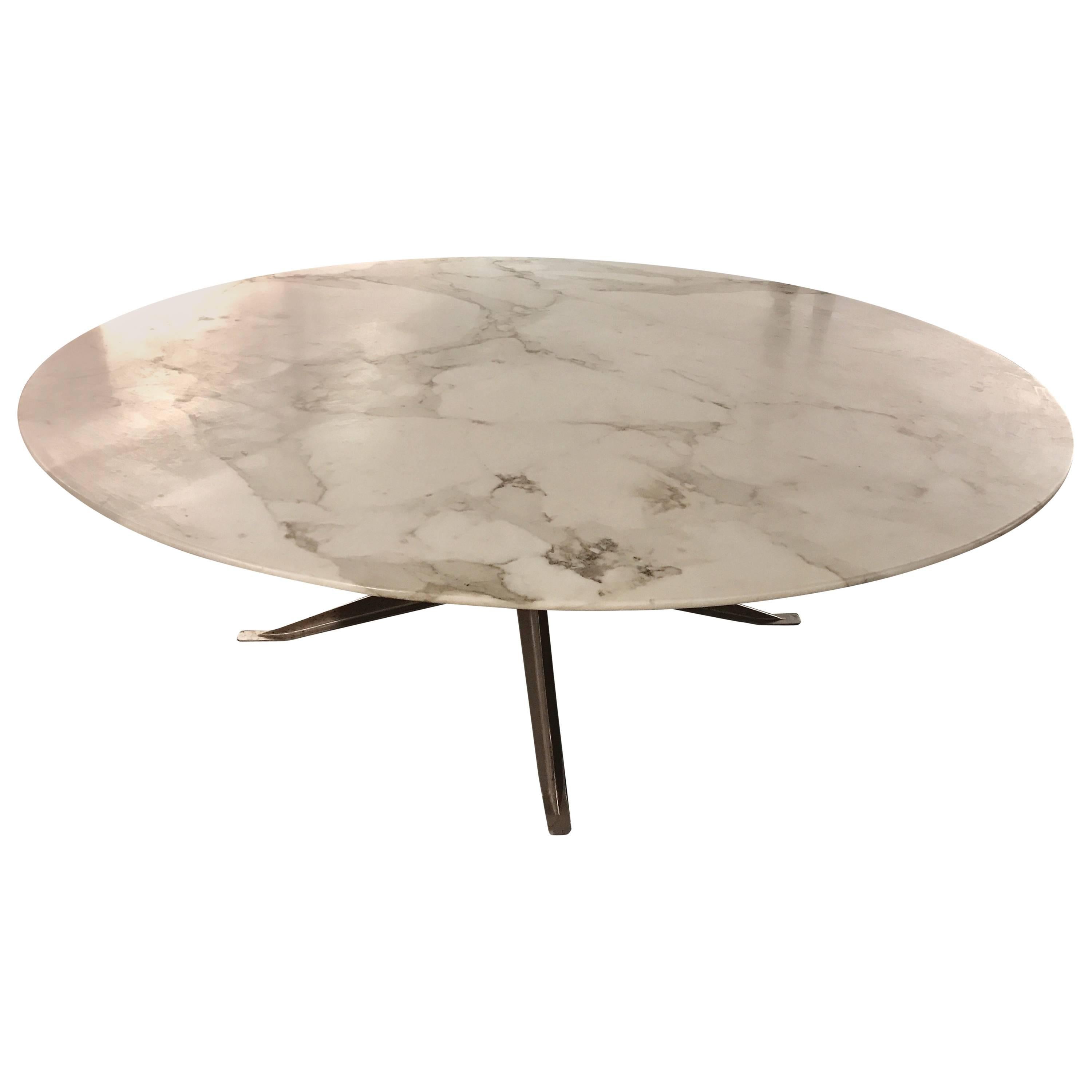 This exceptional grand scale 82" diameter dining or conference table by Florence Knoll has a well selected slab of Calcutta marble. This is most likely a one of a kind table in these dimensions, it was custom-made for the international