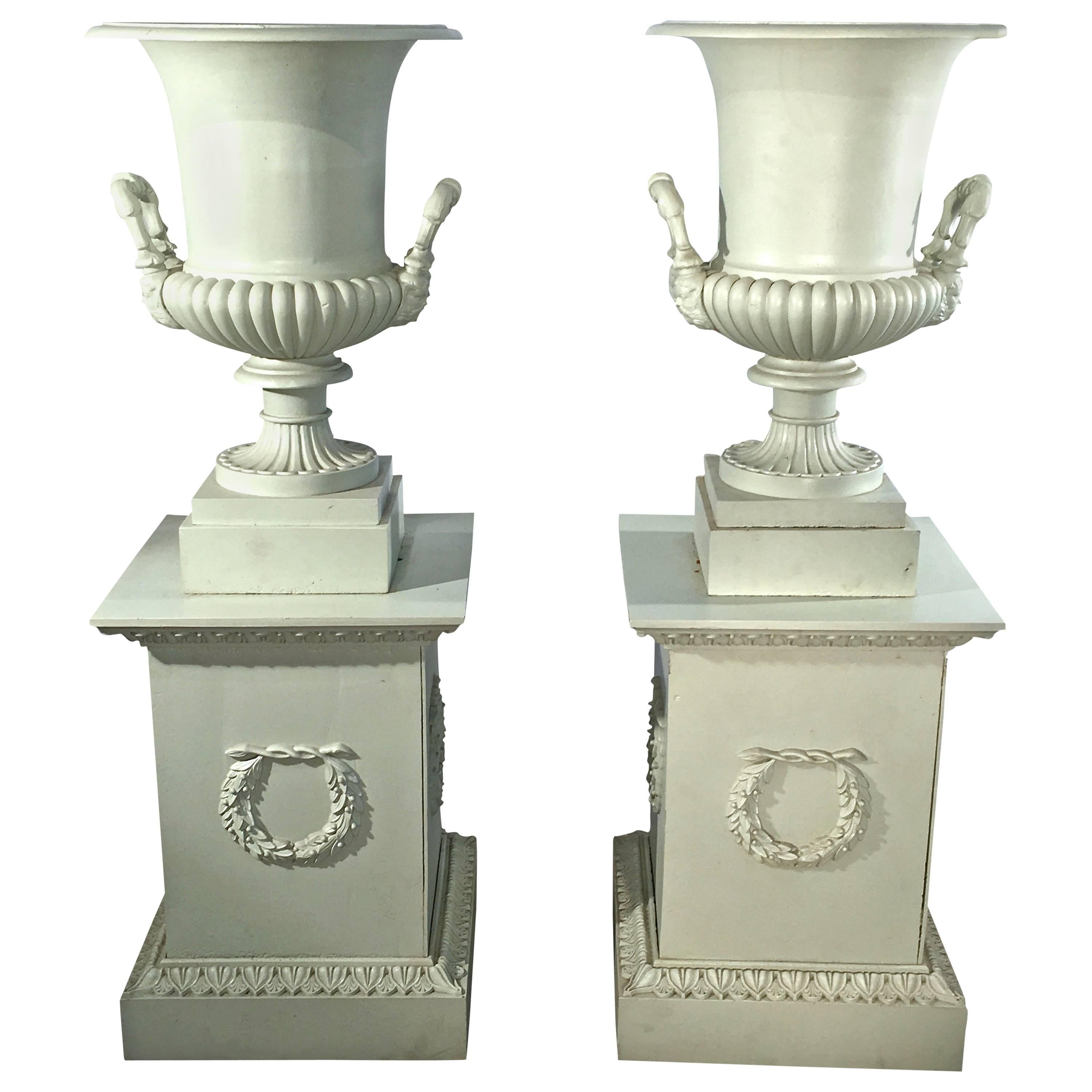 Pair of 19th Century French Cast Iron Masked Urns on Tall Plinths