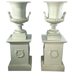 Antique Pair of 19th Century French Cast Iron Masked Urns on Tall Plinths