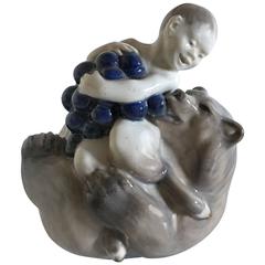Royal Copenhagen Figurine of Faun with Grapes Sitting on a Bear #2318