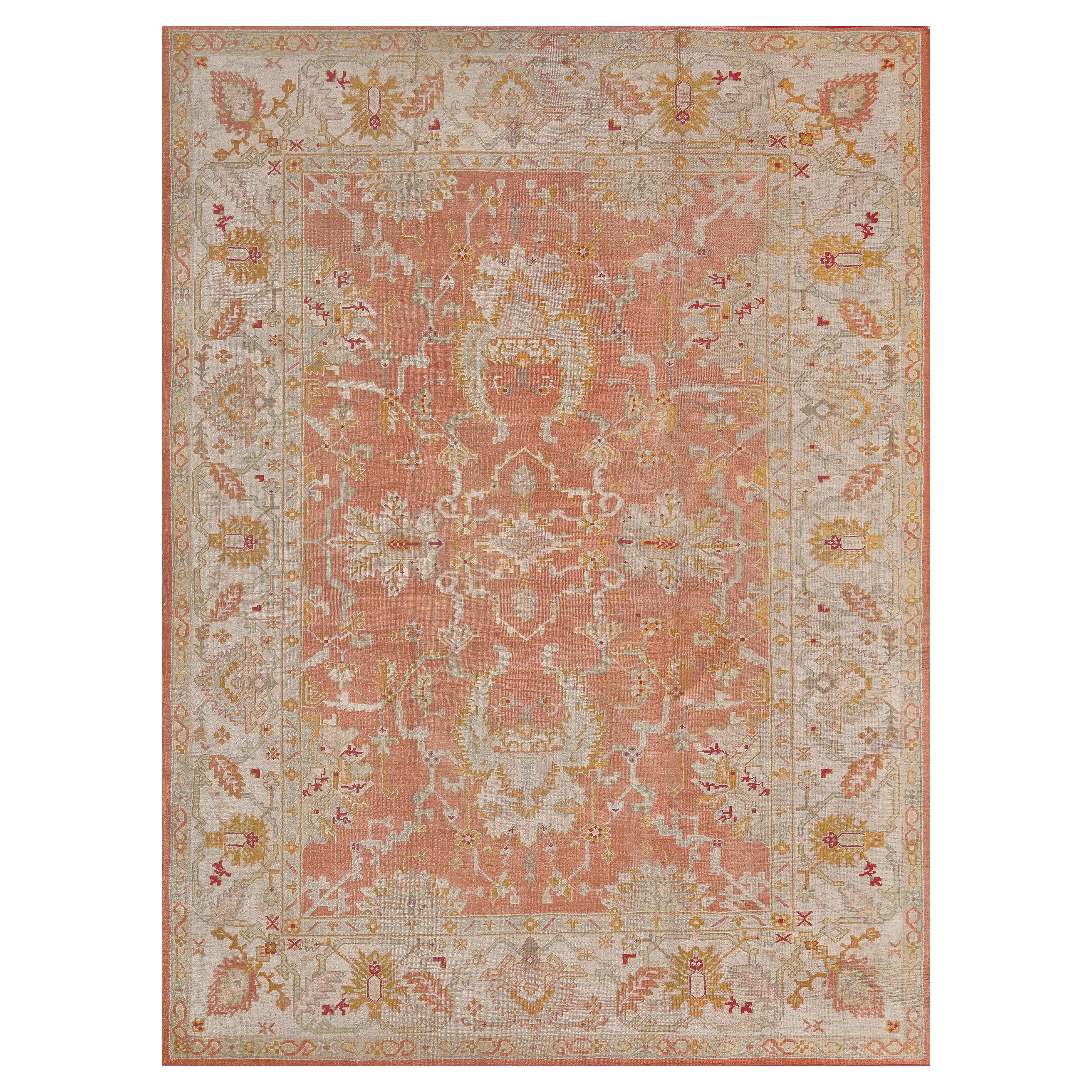 Tapis ancien en laine Oushak rouge et ivoire tissé à la main