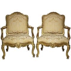 Pair of Italian 19th Century Rococo Style Giltwood Carved Armchairs, circa 1860