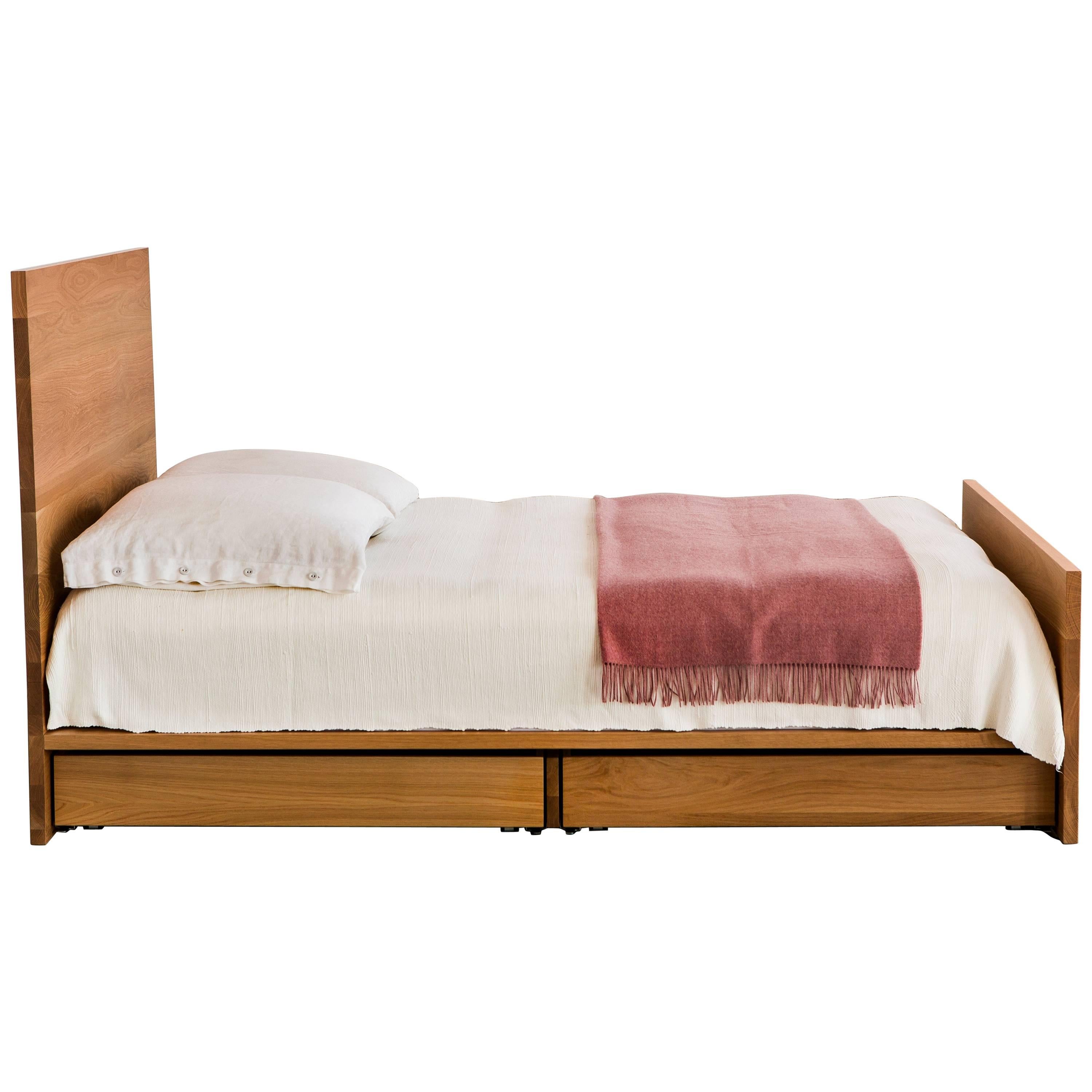 The AB6 bed, an understated platform bed, features discrete storage below (optional) an elegant expanse of solid hardwood. 

Shown in solid white oak with bronze accents. 

Dimensions: 60” W x 46” H x 83” L, platform 9.5” H

All of our solid