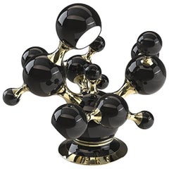 Schwarze Perlen-Tischlampe in glänzender schwarzer Oberfläche und vergoldeter Struktur